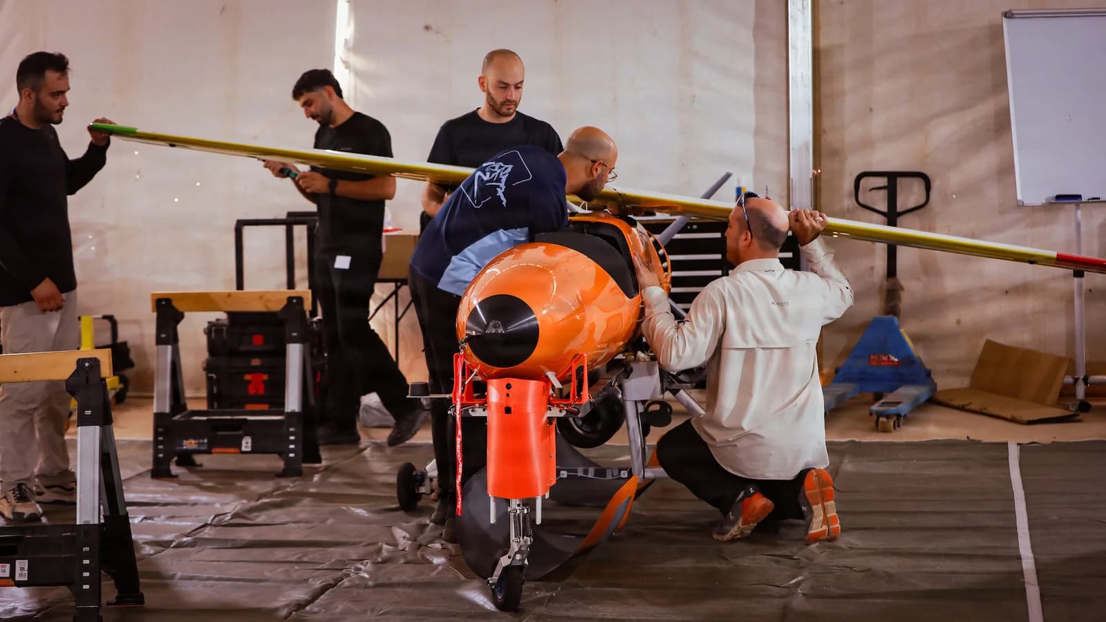 Defence-industry personnel assemble a cruise missile for a live-fire demonstration at AMTEC in Morocco