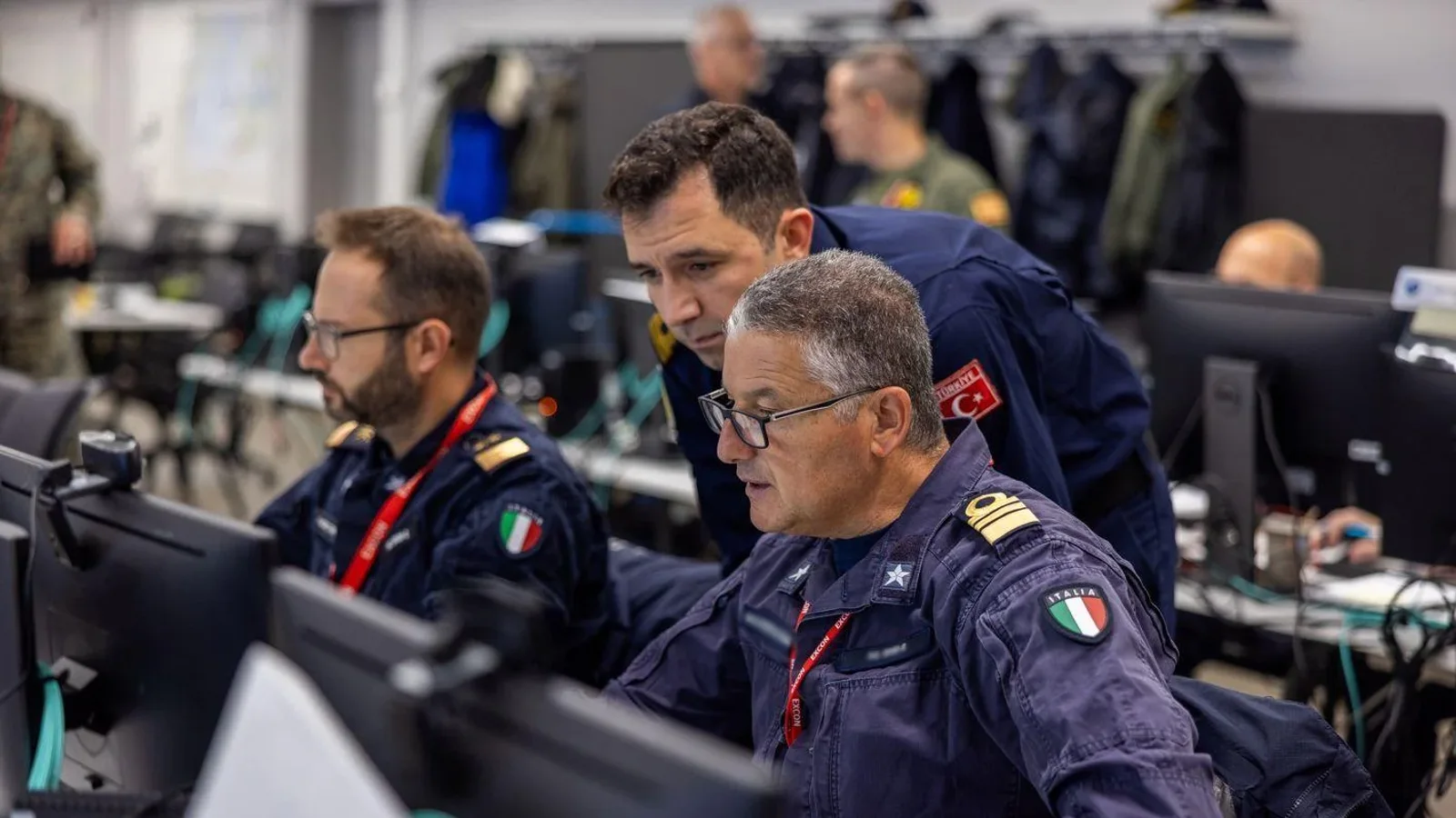 Military participants work at computer stations during the STEADFAST DUEL 2026 command-post exercise