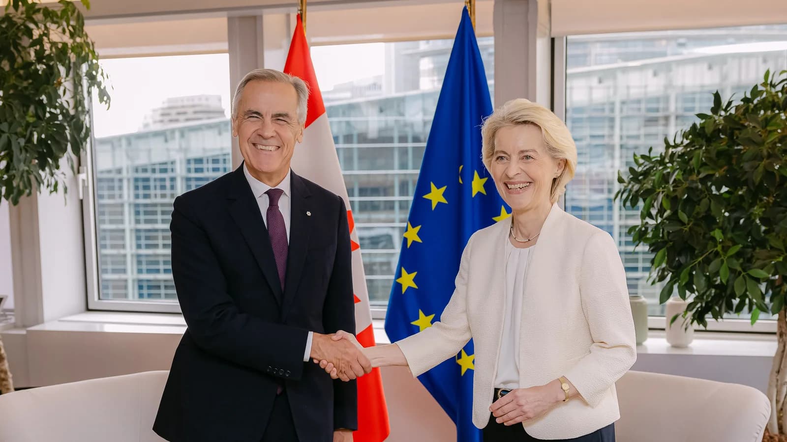 Mark Carney and Ursula von der Leyen shake hands beside Canadian and European Union flags in Strasbourg on September 16, 2026.