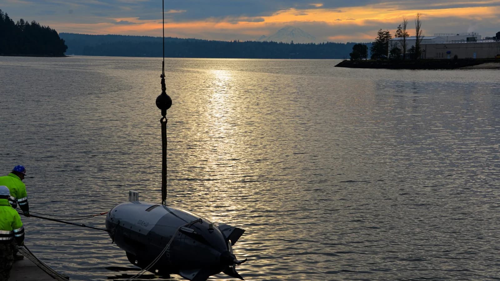 Sailors handle a Dive-LD underwater vehicle during training at Keyport, Washington, on December 11, 2024.