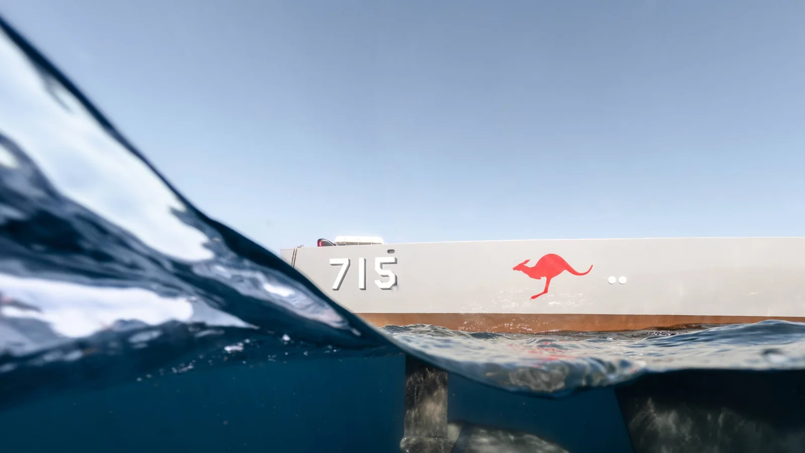 Ocius Bluebottle uncrewed surface vessel viewed above and below the waterline, showing its underwater keel