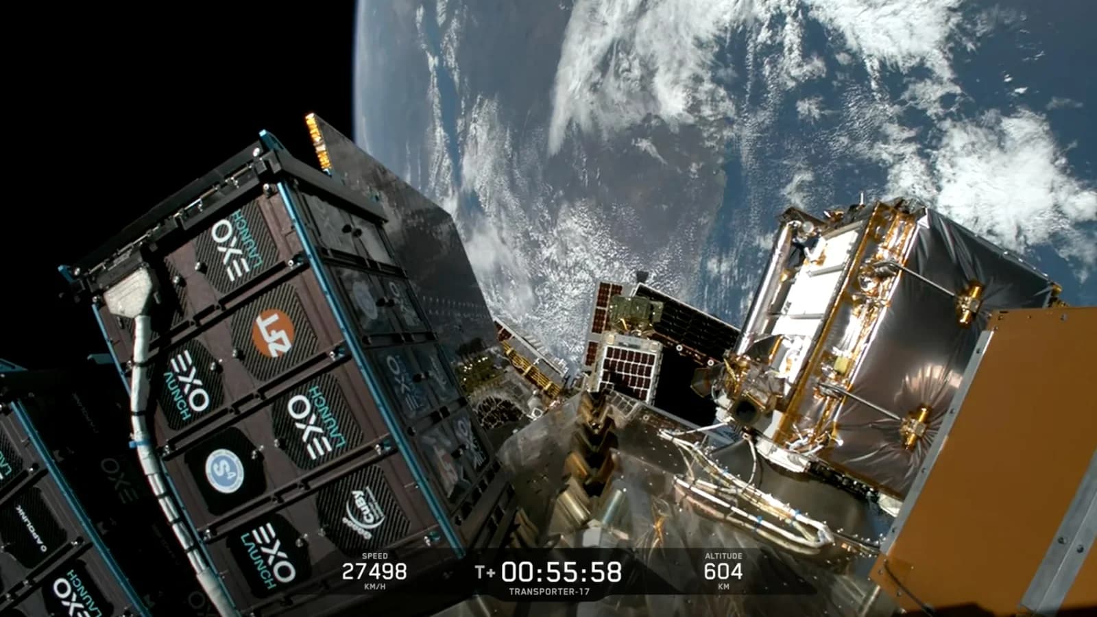 Satellite deployers and small spacecraft above Earth during SpaceX's Transporter-17 rideshare mission